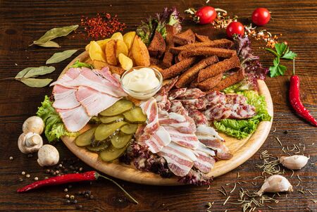 meat appetizers on the wooden backgroundの写真素材