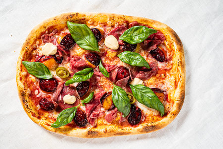 creative pizza with beef and cherriesの写真素材