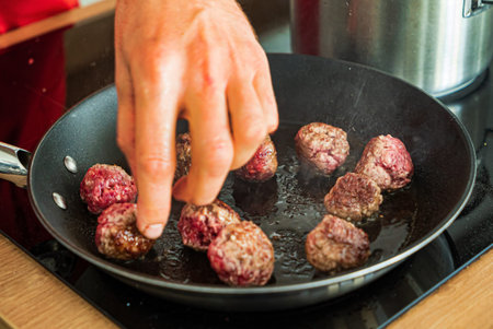 chef making meatballs on the kitchen