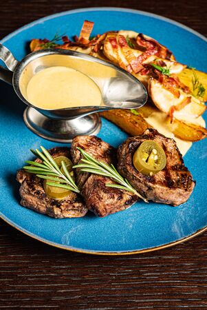 Grilled steak with baked potatoの写真素材