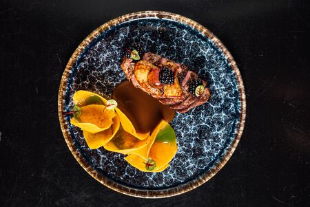 Duck with blackberry sauce on the blackの写真素材