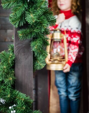 Girl holding vintage lampの写真素材