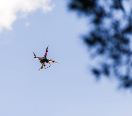 Drone flying on the blue sky