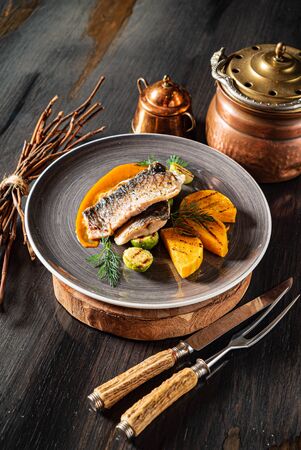 roasted carp fish with grilled vegetablesの写真素材