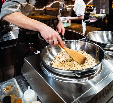 chef cooking in the restaurantの写真素材