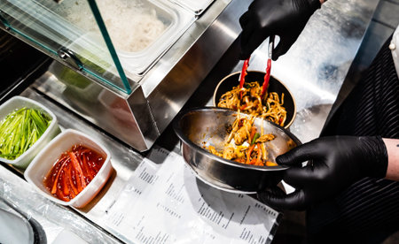 chef cooking noodles in the restaurant