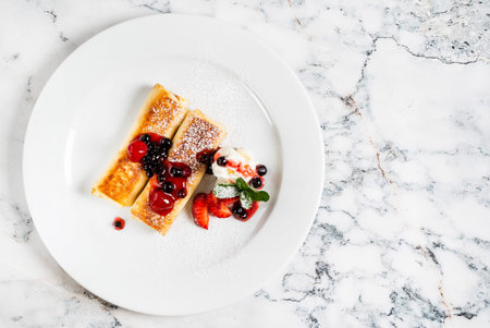 pancakes with strawberries and mint