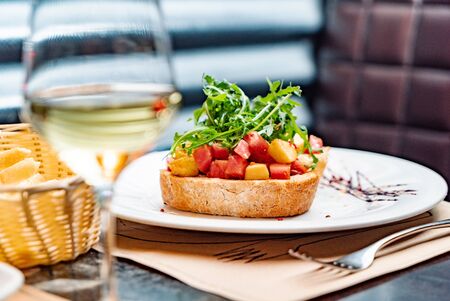 Authentic Italian Bruschetta with Arugula Saladの写真素材