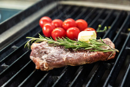 grilled steak with cherry tomatoes and rosemary