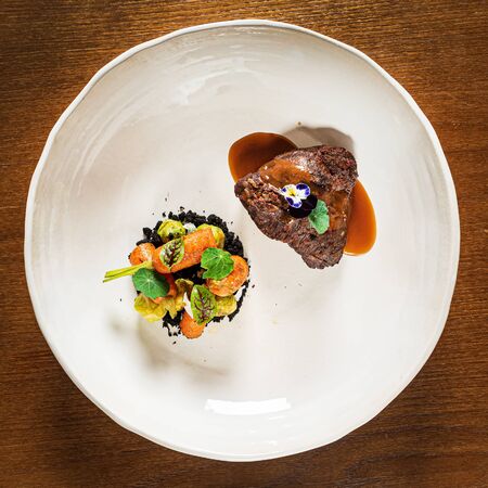 steak with vegetables and microgreensの写真素材