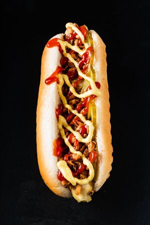 hot dog on the black backgroundの写真素材