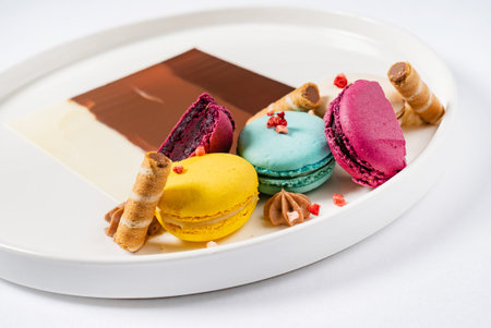Sweet and colourful dessert with macaroons and chocolateの写真素材