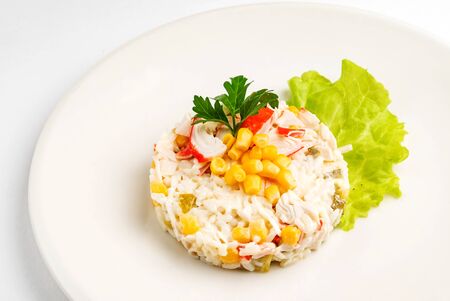 salad made of crab sticks, corn, egg, pepper, and cucumberの写真素材