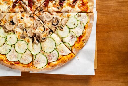 italian pizza on the wooden backgroundの写真素材