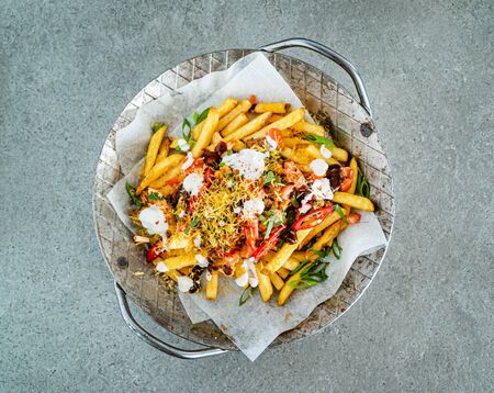 french fries with minced meat, beans and vegetablesの写真素材