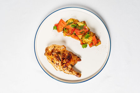 Chicken with roasted vegetables on the white