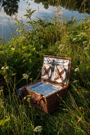 straw basket on the meadowの写真素材