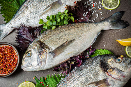 Delicious fresh fish on dark  backgroundの写真素材