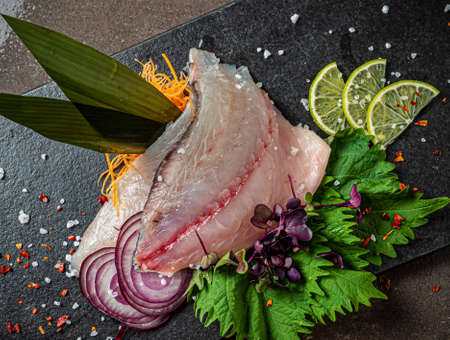 Delicious fresh fish on dark  backgroundの写真素材