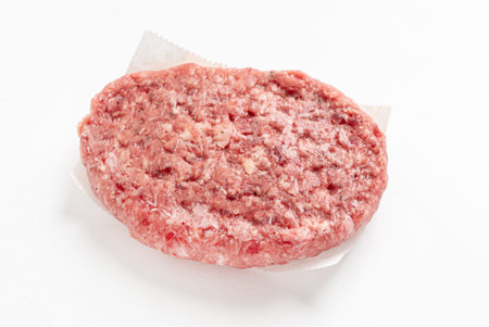 Raw minced homemade cutlets, on the white background