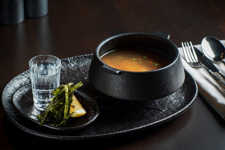 Ukha soup and vodka on table