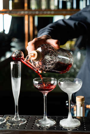 bartender making cocktail in the barの写真素材