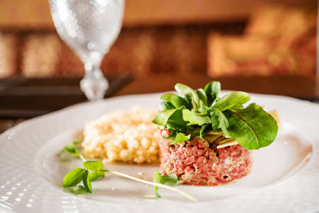 beef tartar on the white plateの写真素材
