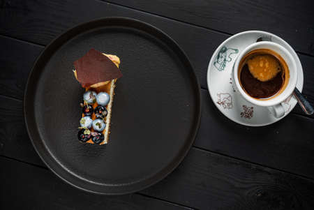 luxury pastry on the black plateの写真素材