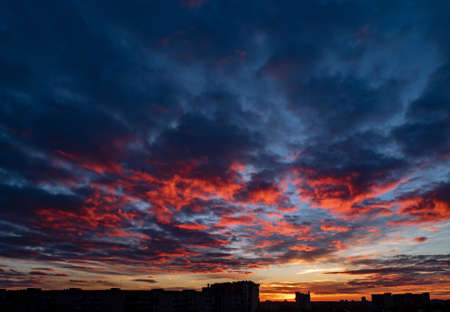 Sunset at city with building silhouetteの写真素材