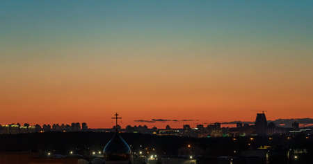 Sunset at city with building silhouetteの写真素材