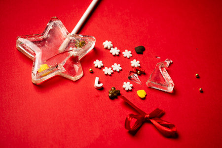 Christmas lollipop on the red backgroundの写真素材