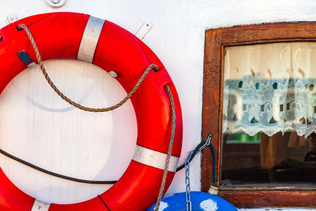 Composition with lifebuoy ring on old yachtの写真素材