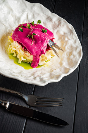 fish with mashed potato on black backgroundの写真素材