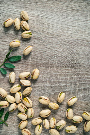 fresh pistachio on the wooden backgroundの写真素材