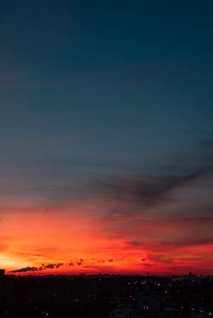 orange sunset over big cityの写真素材