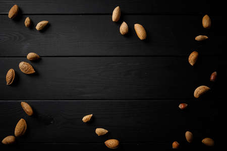 nuts on the wooden black backgroundの写真素材