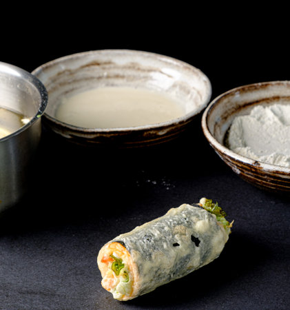 chef making tempura roll in the restaurantの写真素材