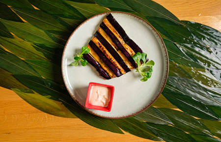 grilled aubergine with tahini sauceの写真素材