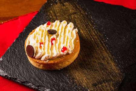 lemon tart with chocolate  in the restaurantの写真素材