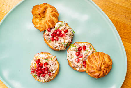 canape with meat salad and pomegranate seedsの写真素材
