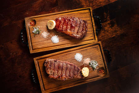 Beef Steak on wooden boardの写真素材