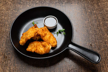 fried fish with soy sauceの写真素材