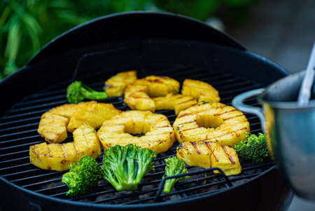 Grilled pineapple slices ready to eat.の写真素材