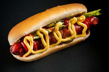 hot dog on the black backgroundの写真素材