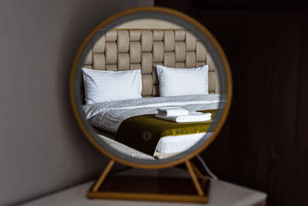 bed with white pillow and towelの写真素材