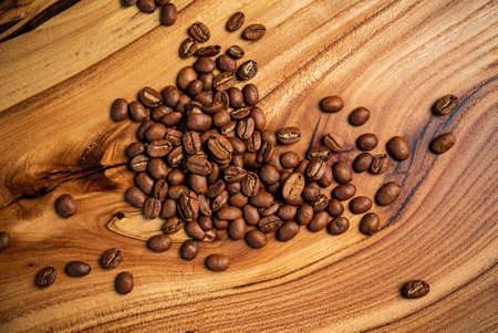 coffee beans on the wooden backgroundの写真素材