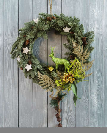 Christmas wreath on the wooden wallの写真素材