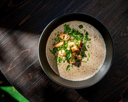 cream soup with mushrooms and crouutonsの写真素材