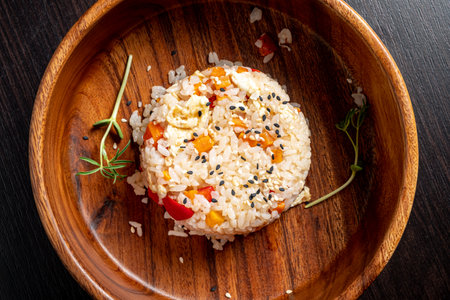 rice with vegetables in the wooden bowlの写真素材