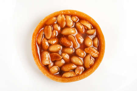 caramel tart with almon isolatedの写真素材